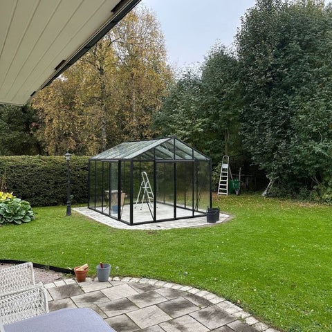 A Scandiglas greenhouse in an owner's garden