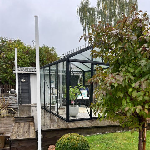 A Scandiglas greenhouse in an owner's garden
