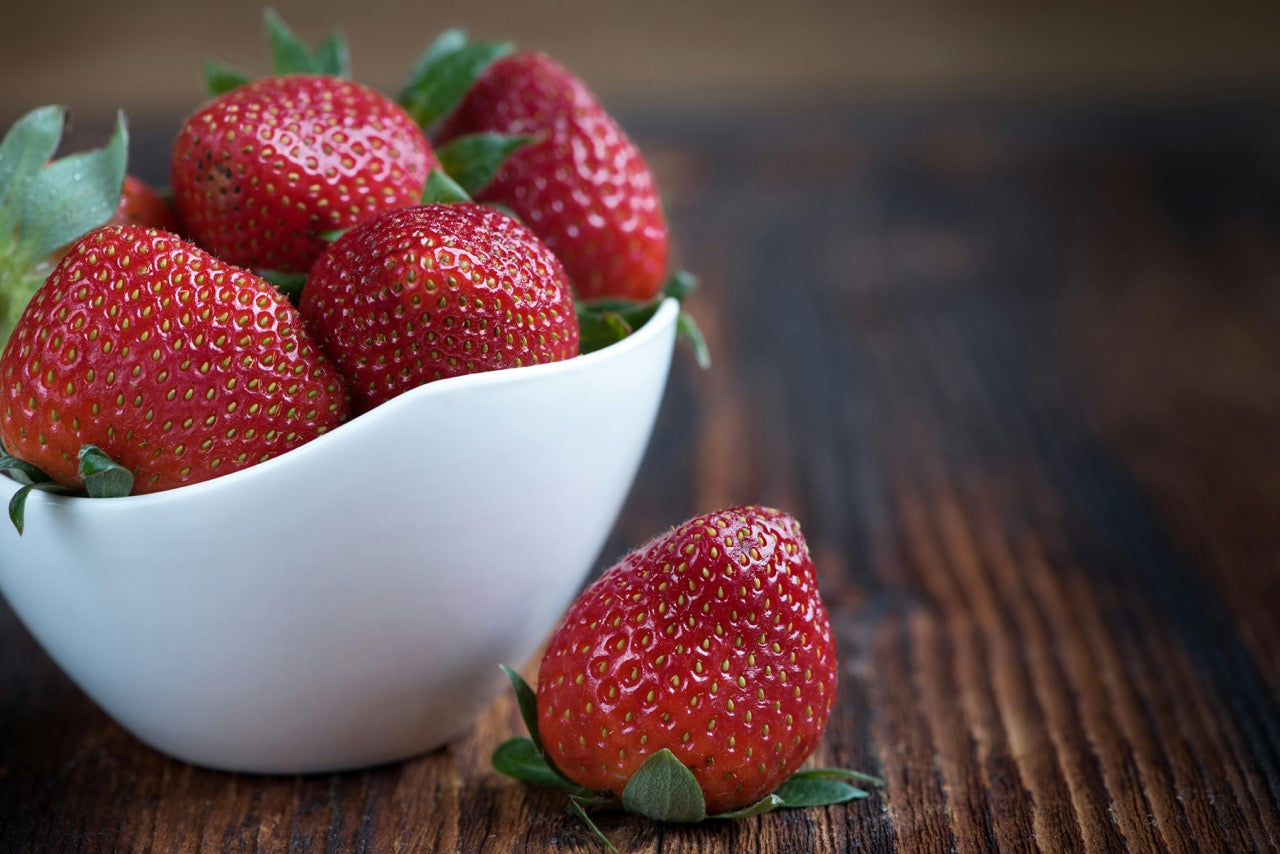 A photo of strawberries in a bowl