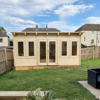 Wooden shed with glass doors and windows in a backyard setting.