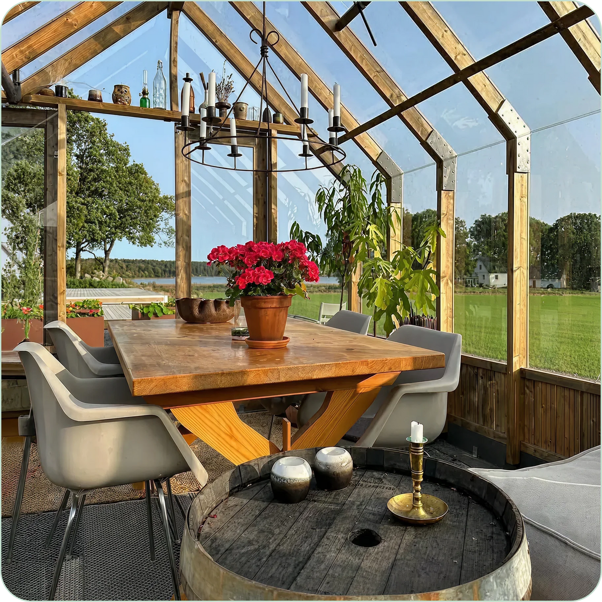 Dining table inside a glass Nordwood garden room