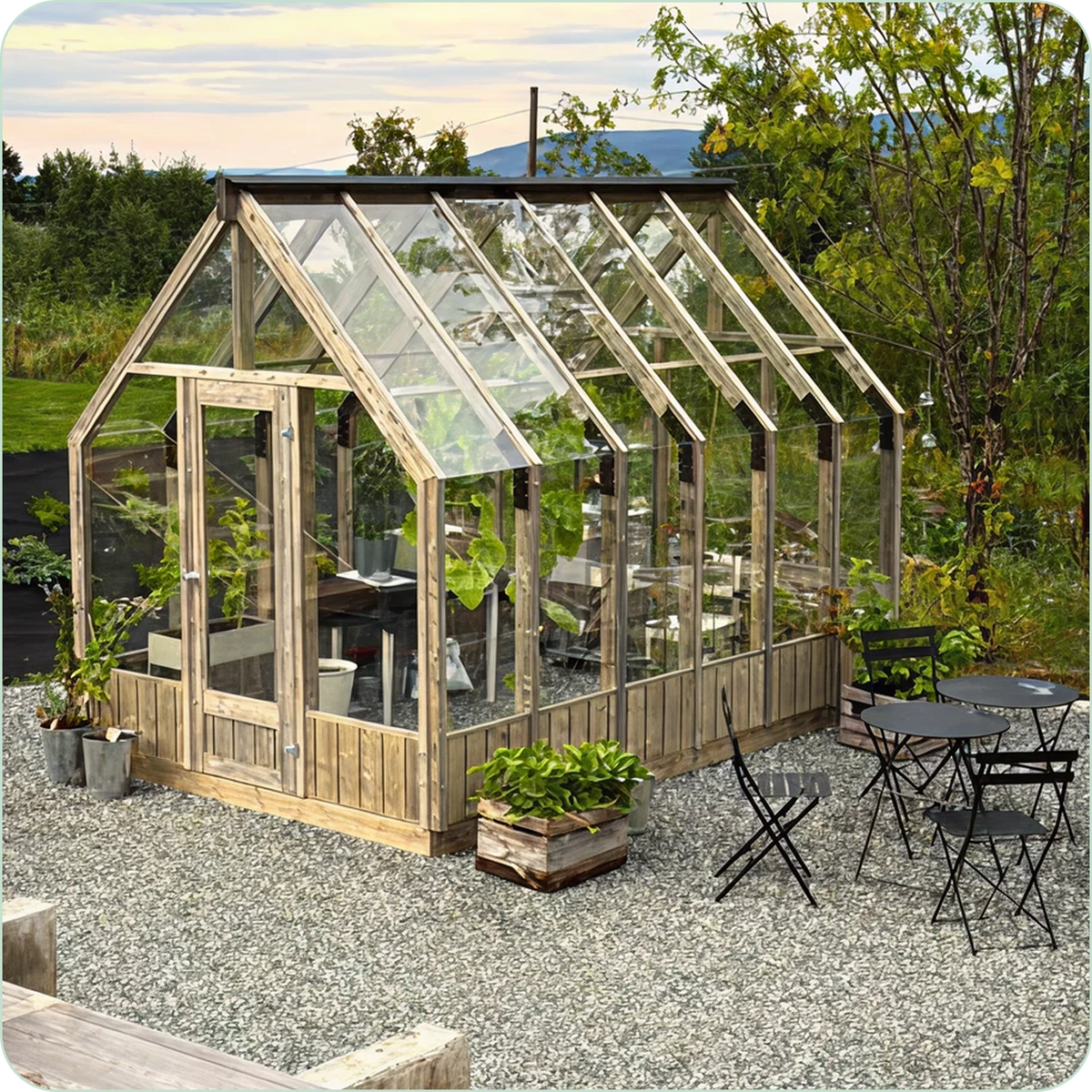 Nordwood greenhouse on gravel with outdoor seating