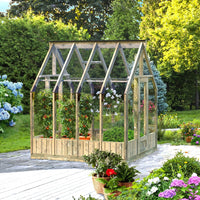 Wooden greenhouse with plants and flowers in a garden setting