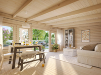 Wooden interior of a cabin with a dining table and living area.
