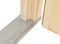 Close-up of a metal tool being used on wooden planks.
