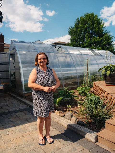A polycarbonate greenhouse in an owner's garden