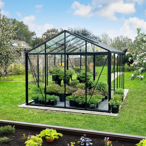 A Scandiglas greenhouse in an owner's garden