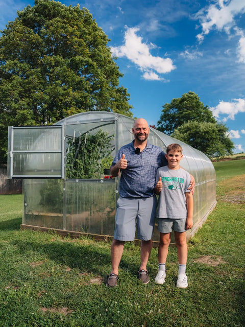 A polycarbonate greenhouse in an owner's garden