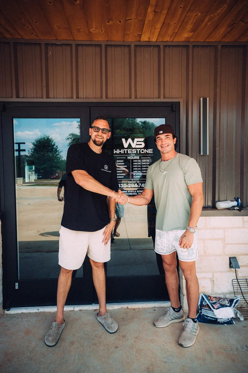 A handshake on handoff day at a Nordwood build