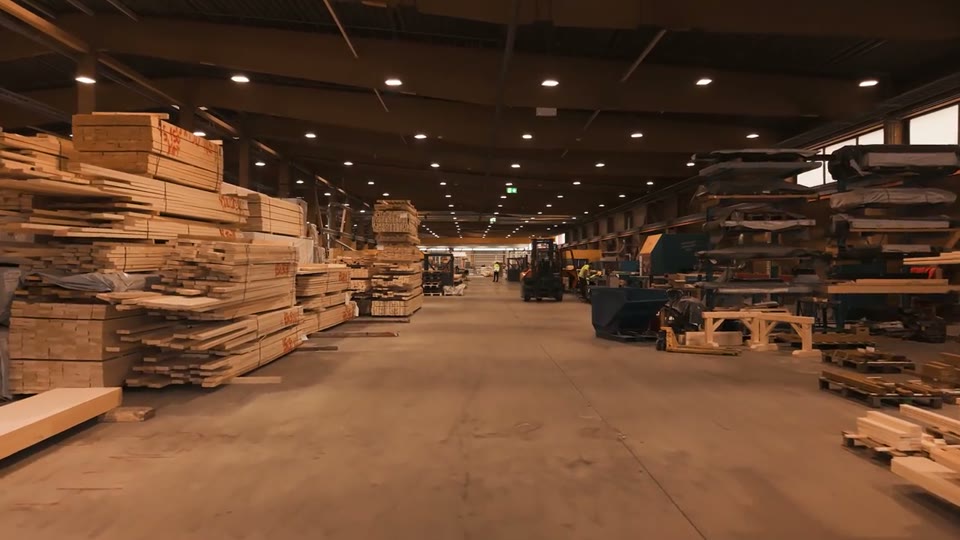 Stacked timber in the Nordwood factory hall